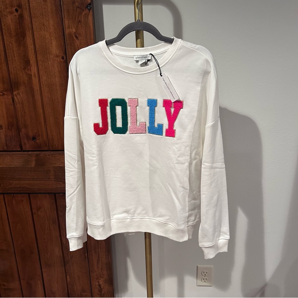 Cupcakes & Cashmere Sweatshirt with Colorful 'JOLLY' Text